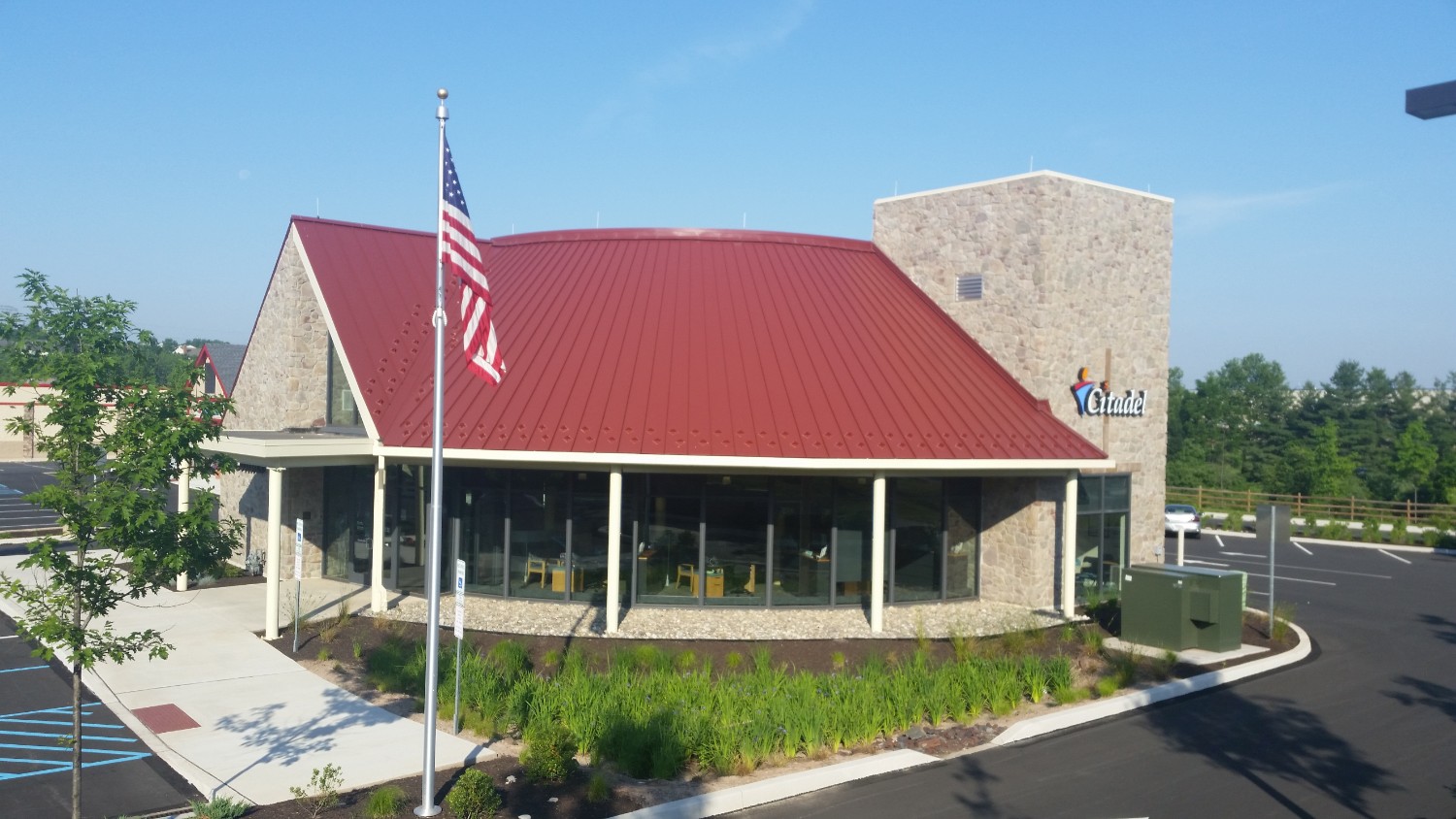 Curved metal roof in striking red for Citadel